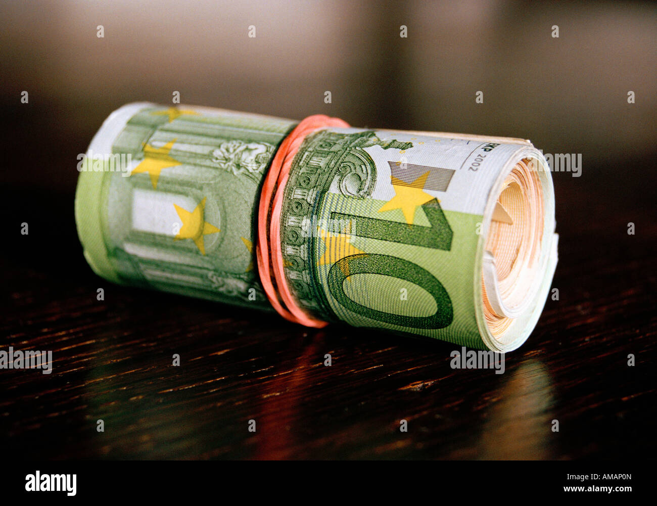 A roll of Euro banknotes Stock Photo