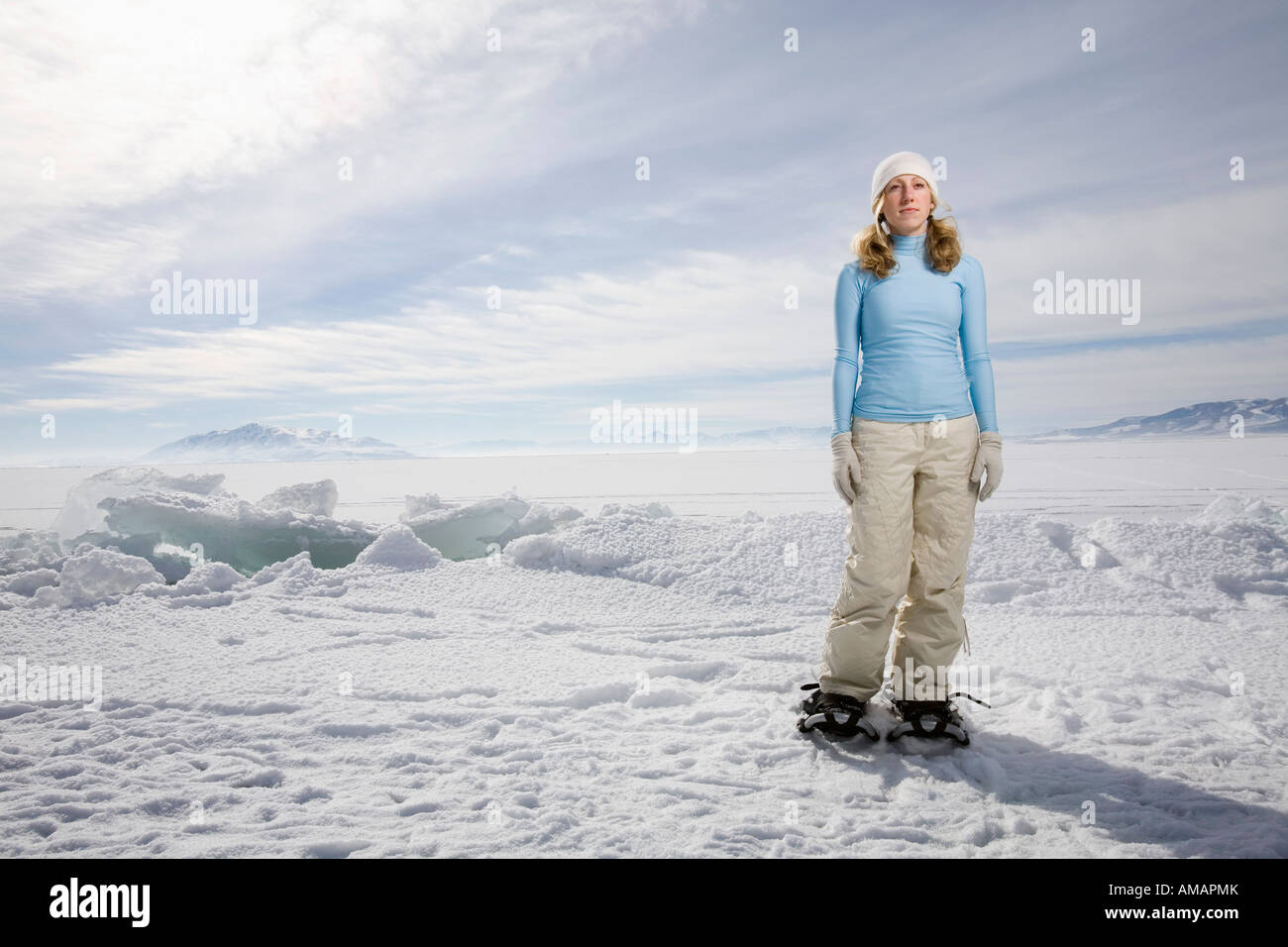 A woman standing in the snow Stock Photo - Alamy
