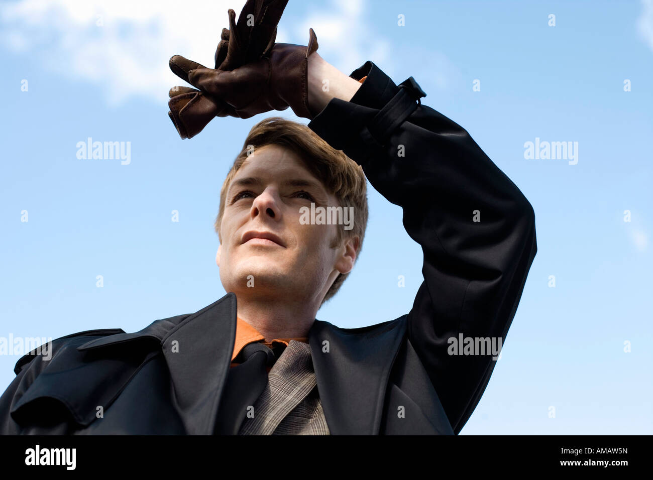 A businessman shielding his eyes Stock Photo - Alamy