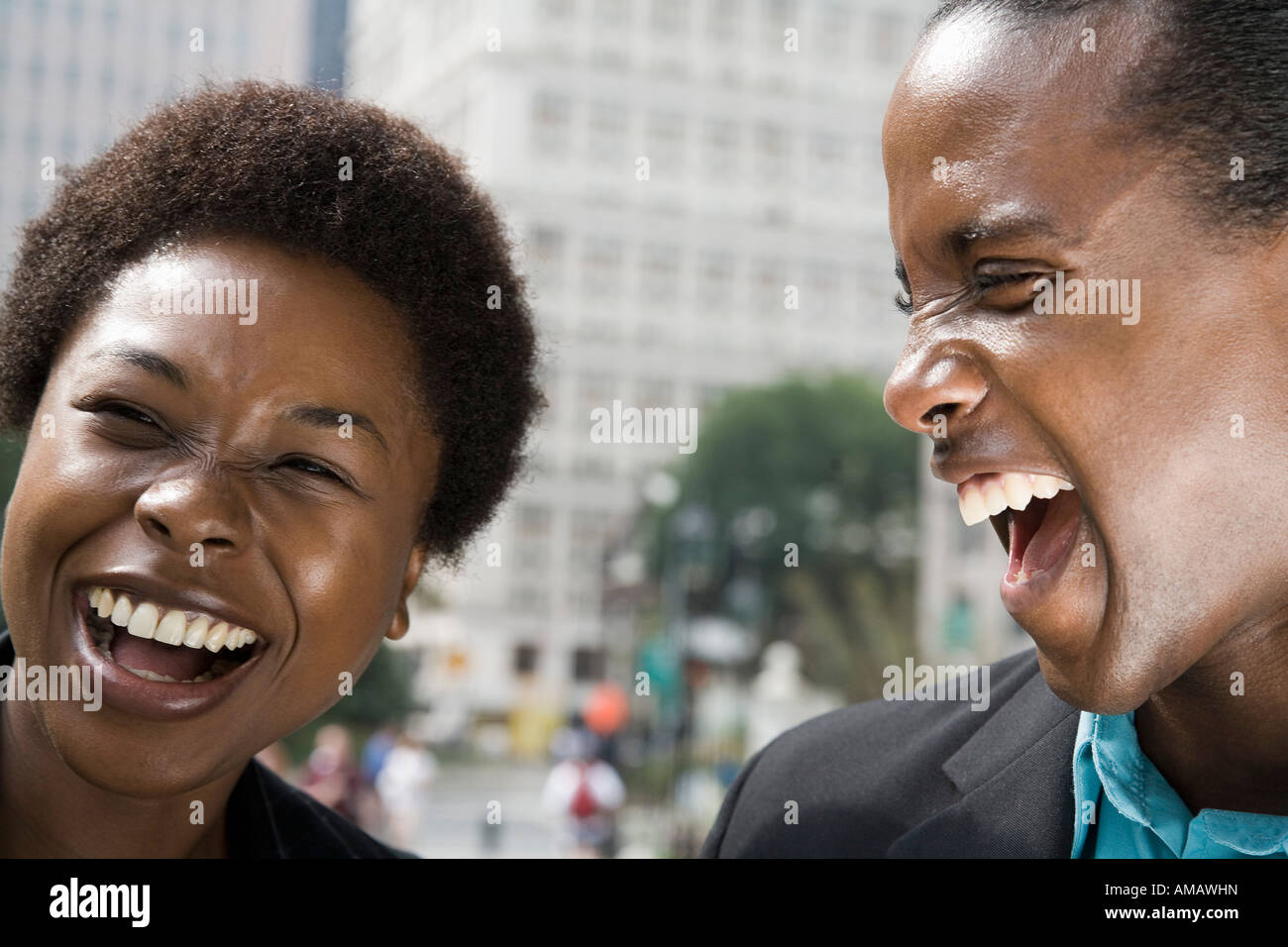 A woman and man laughing together outside Stock Photo - Alamy