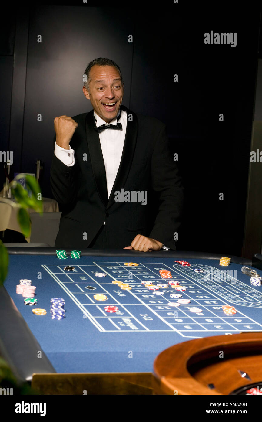 Euro Casino. Man winning at roulette table Stock Photo