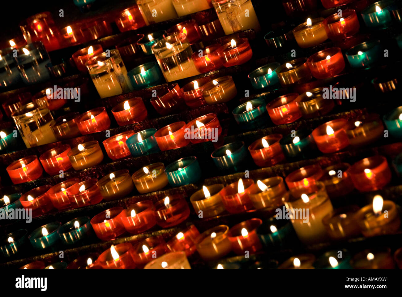 images of candles in churches in which a prayer is made and a candle lit to think about loved