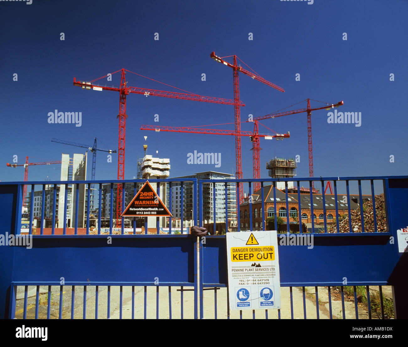skyline of cranes on construction site of new apartments and offices at clarence dock leeds