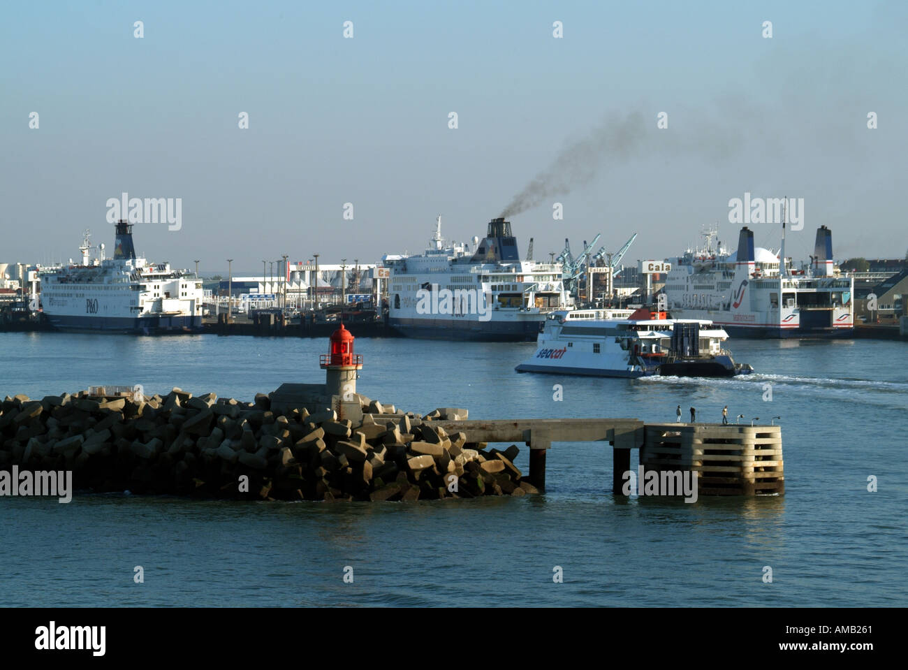 Approaches to Calais harbour & French ferry terminal port installations P&O  Sea France cross channel ferries moored with Seacat catamaran arriving  Stock Photo - Alamy
