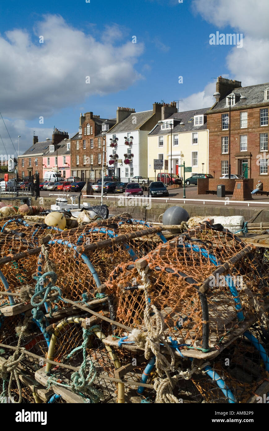dh Arbroath harbour ARBROATH ANGUS Fishing creels alongside quay side and row of harbour houses Stock Photo