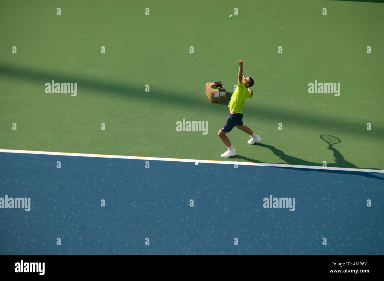 A tennisman serves during a practice game Stock Photo