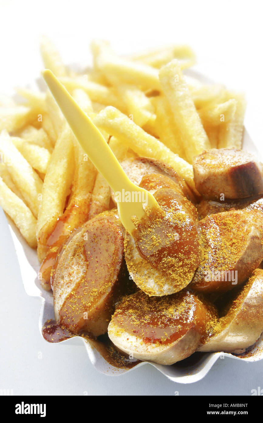 dish with chips and curried sausage Stock Photo Alamy
