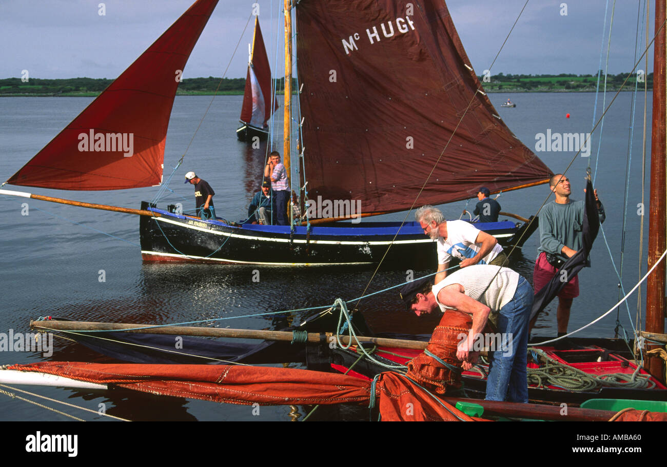 County Galway, Ireland. Traditional red sails fishing boats known as a Galway Bay hooker. Annual sailing festival at Kinvara. Stock Photo