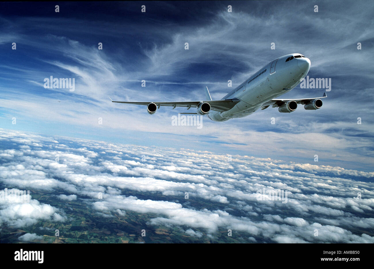 Airbus A340 above the clouds Stock Photo