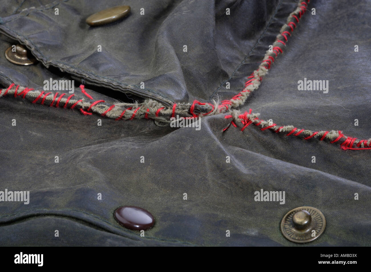 Crudely sewn repair to a waxed jacket Stock Photo Alamy