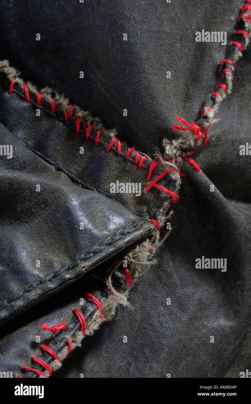 Crudely sewn repair to a waxed jacket Stock Photo Alamy