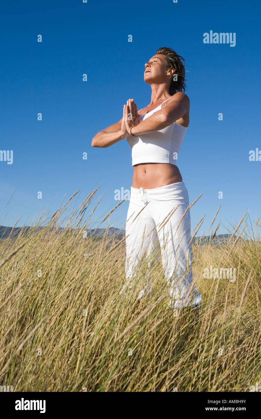 Woman meditating in nature Stock Photo - Alamy