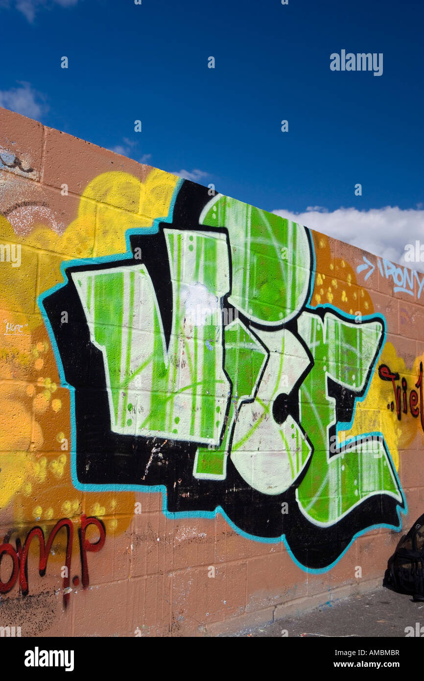 Spray can graffiti on an urban wall Stock Photo