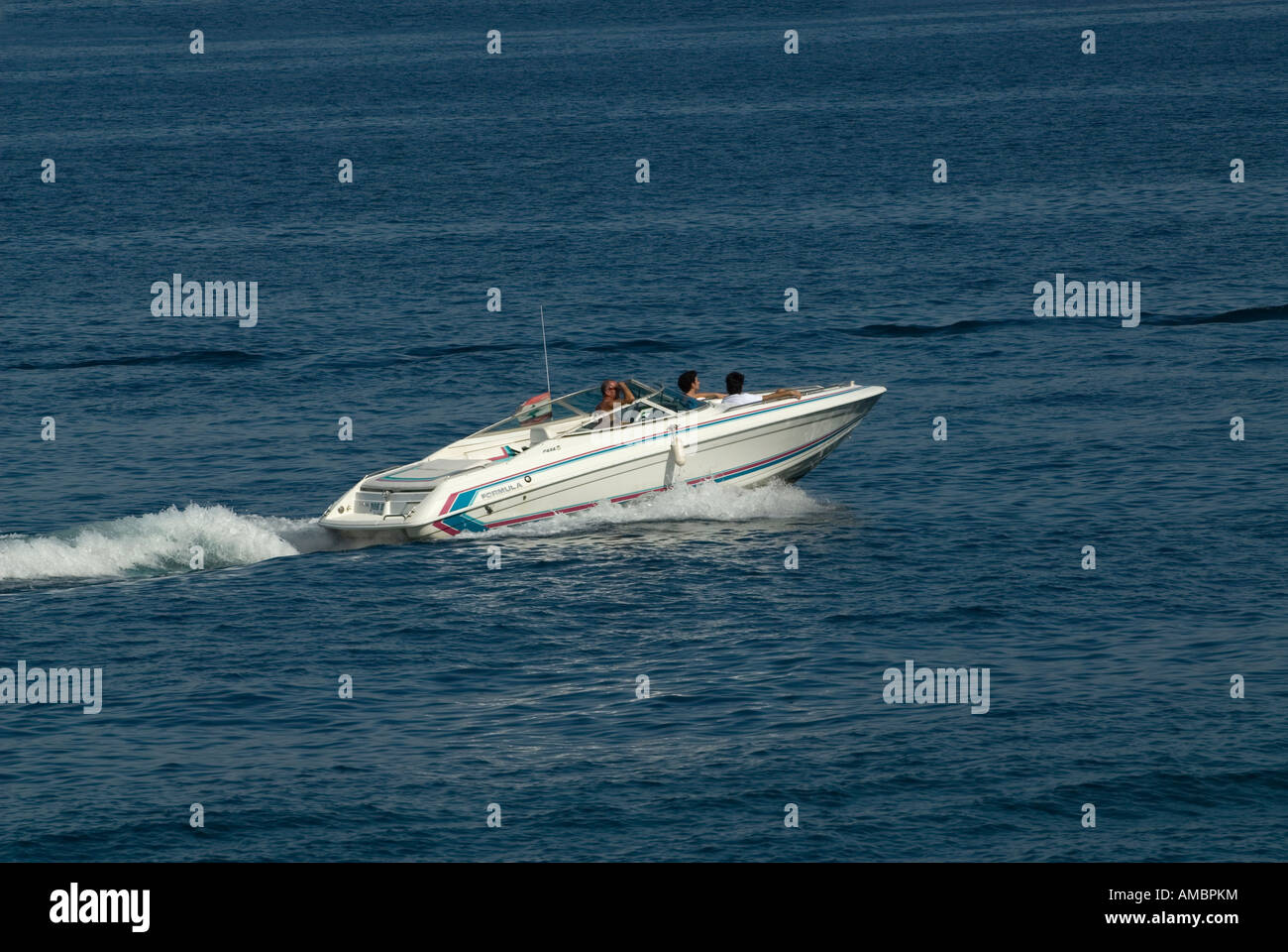 Family in a speedboat in the Mediterranean Stock Photo