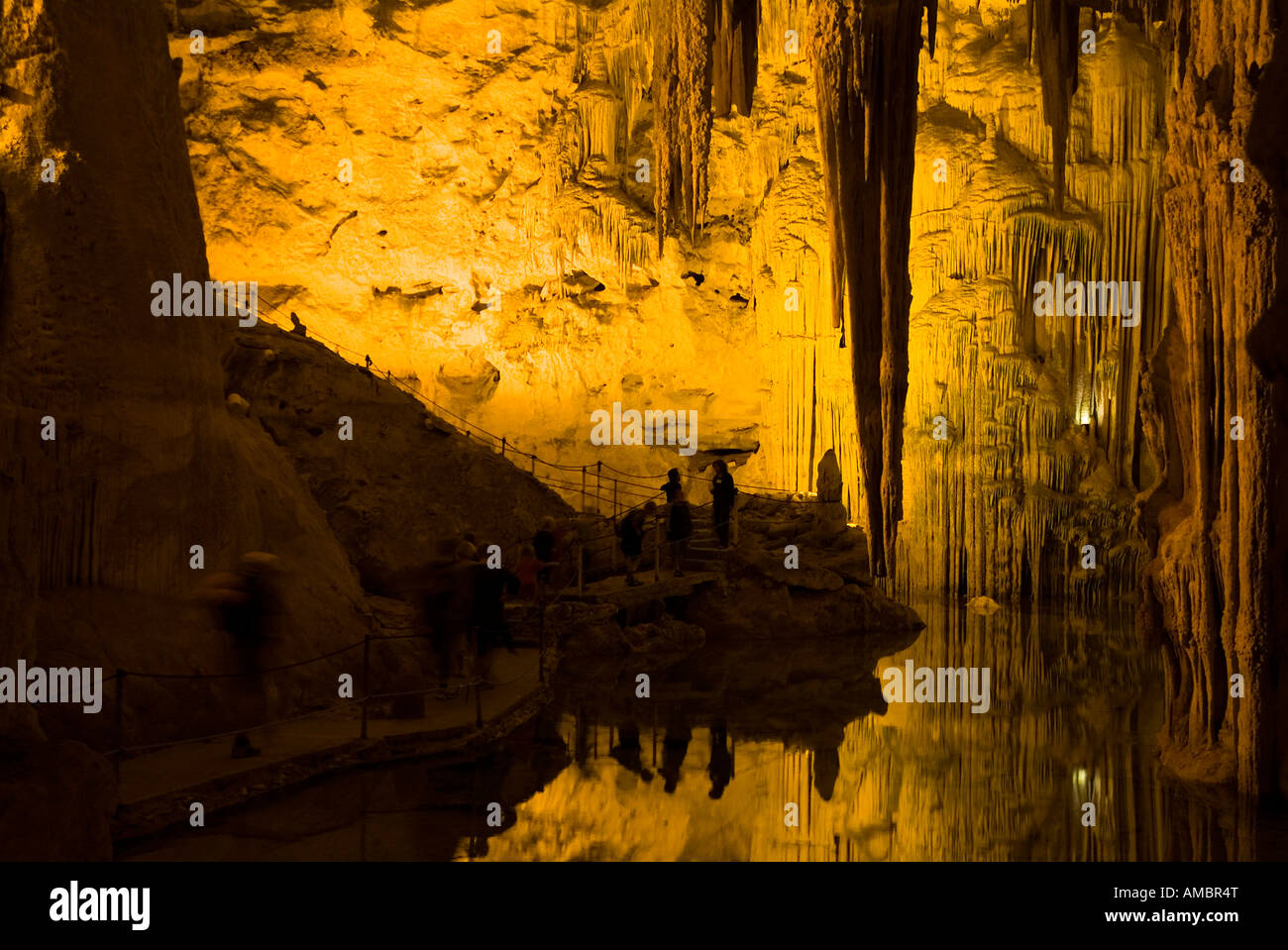 dh Neptune sea Caves CAPE CACCIA SARDINIA People in stalactites stalagmites cave stalagtites limestone capo cavern alghero calcium neptunes grotto Stock Photo