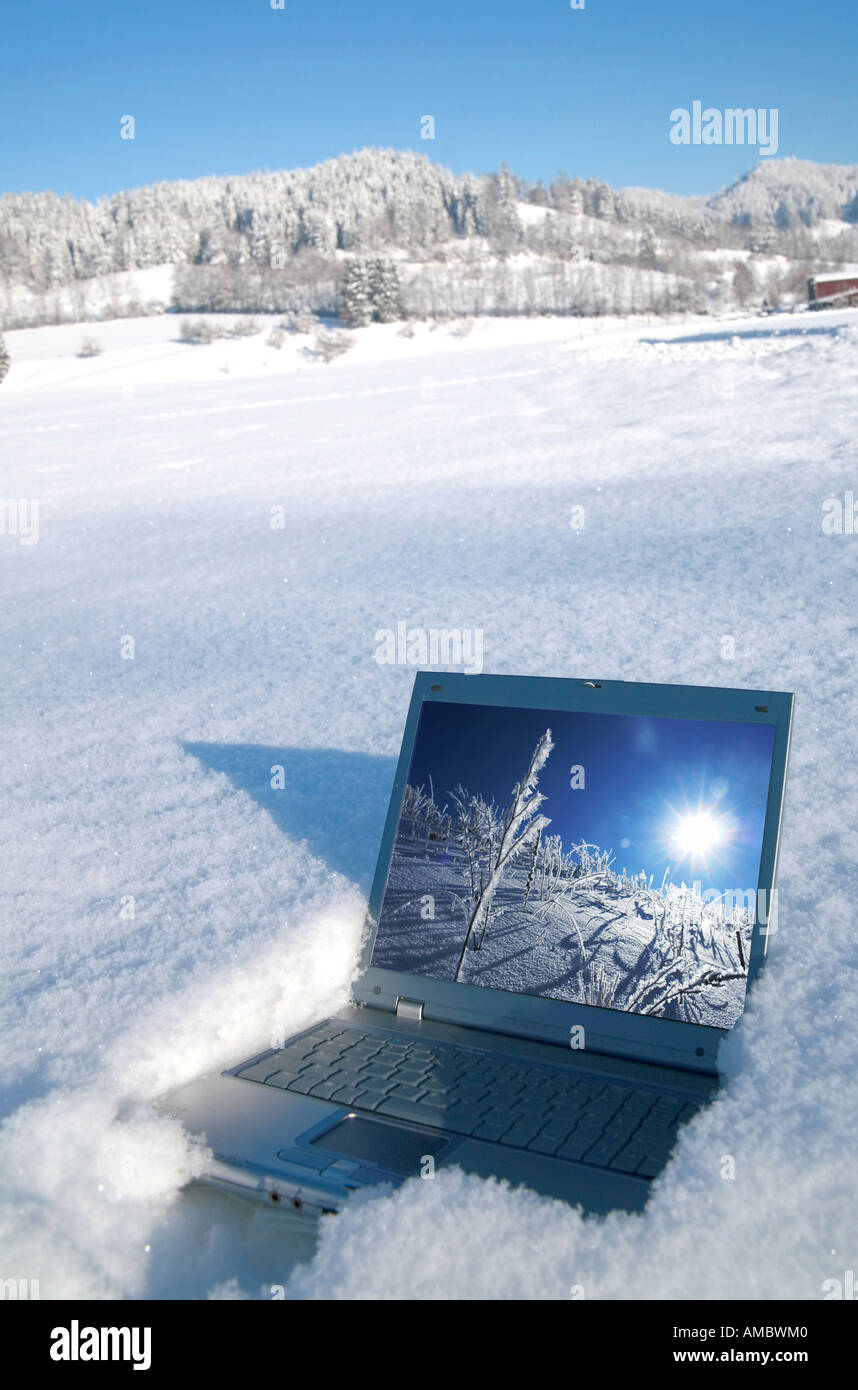 Laptop in a winter landscape scene Stock Photo - Alamy
