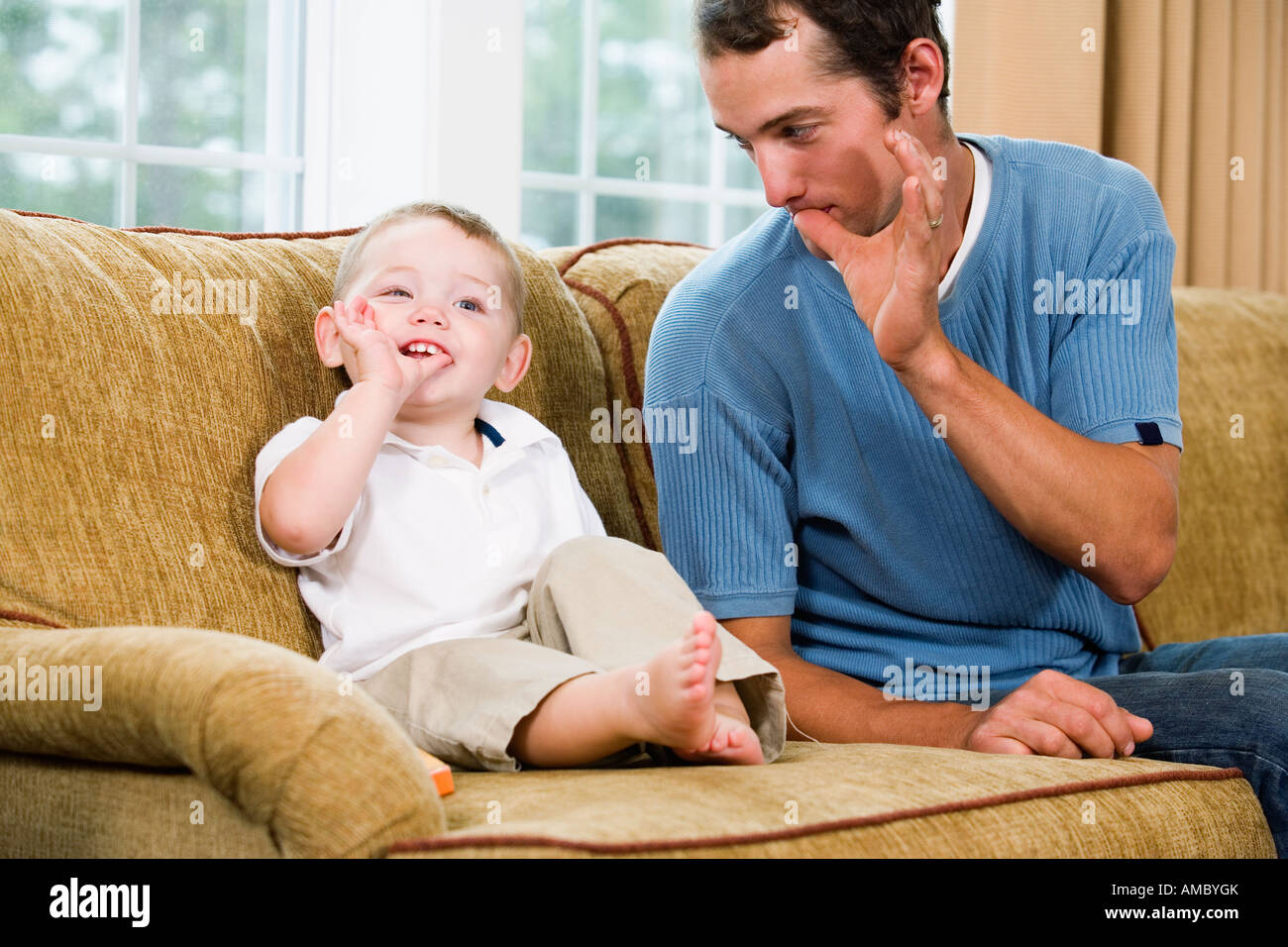 Father teaching son sign language Stock Photo Alamy
