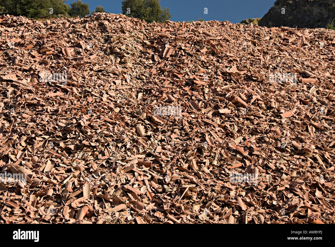 recycling of old roof tiles in france near limoux with large piles of