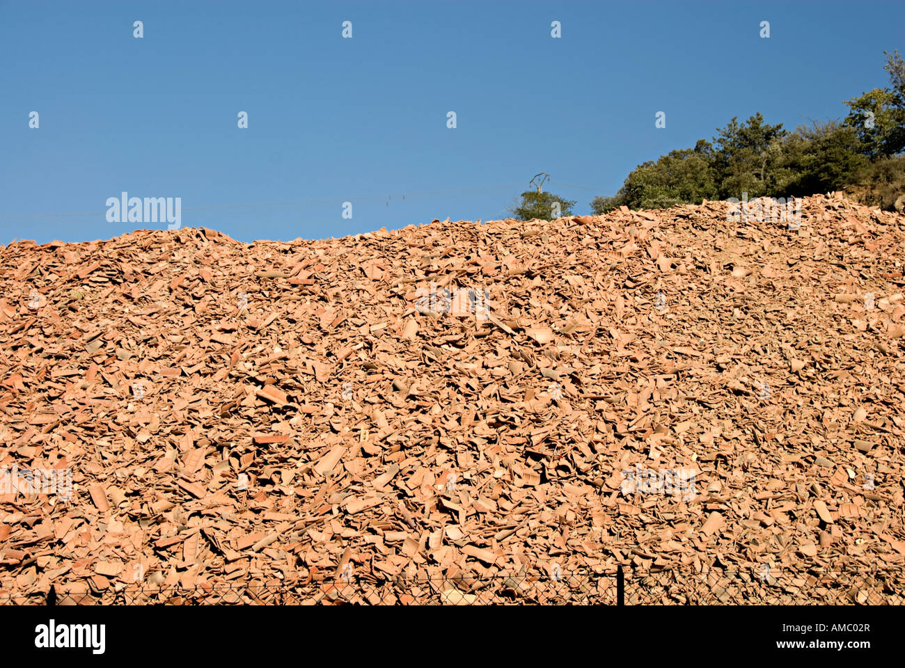 recycling of old roof tiles in france near limoux with large piles of