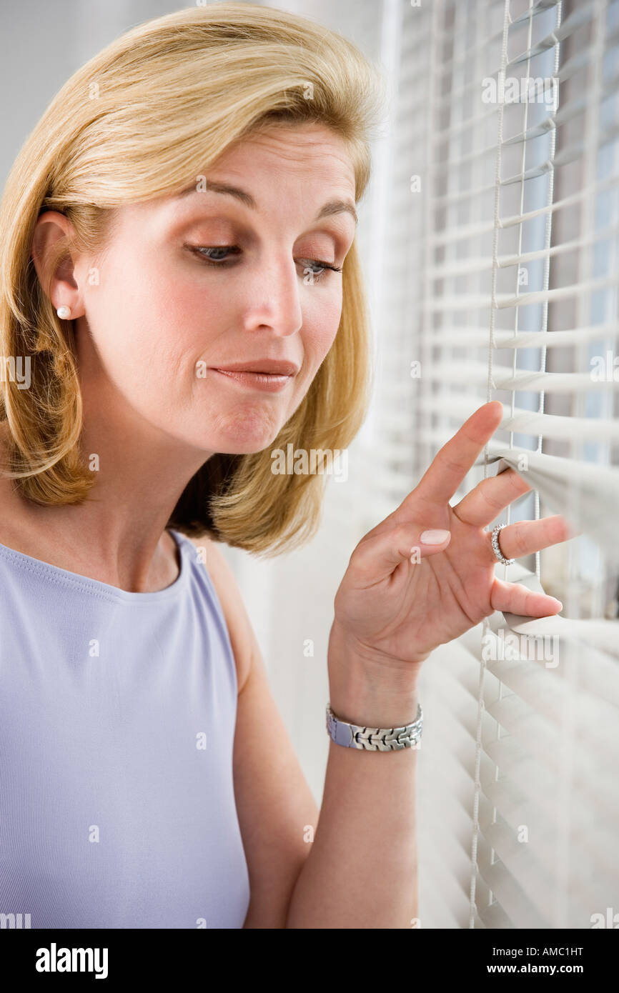 Peeping out window woman hires stock photography and images Alamy