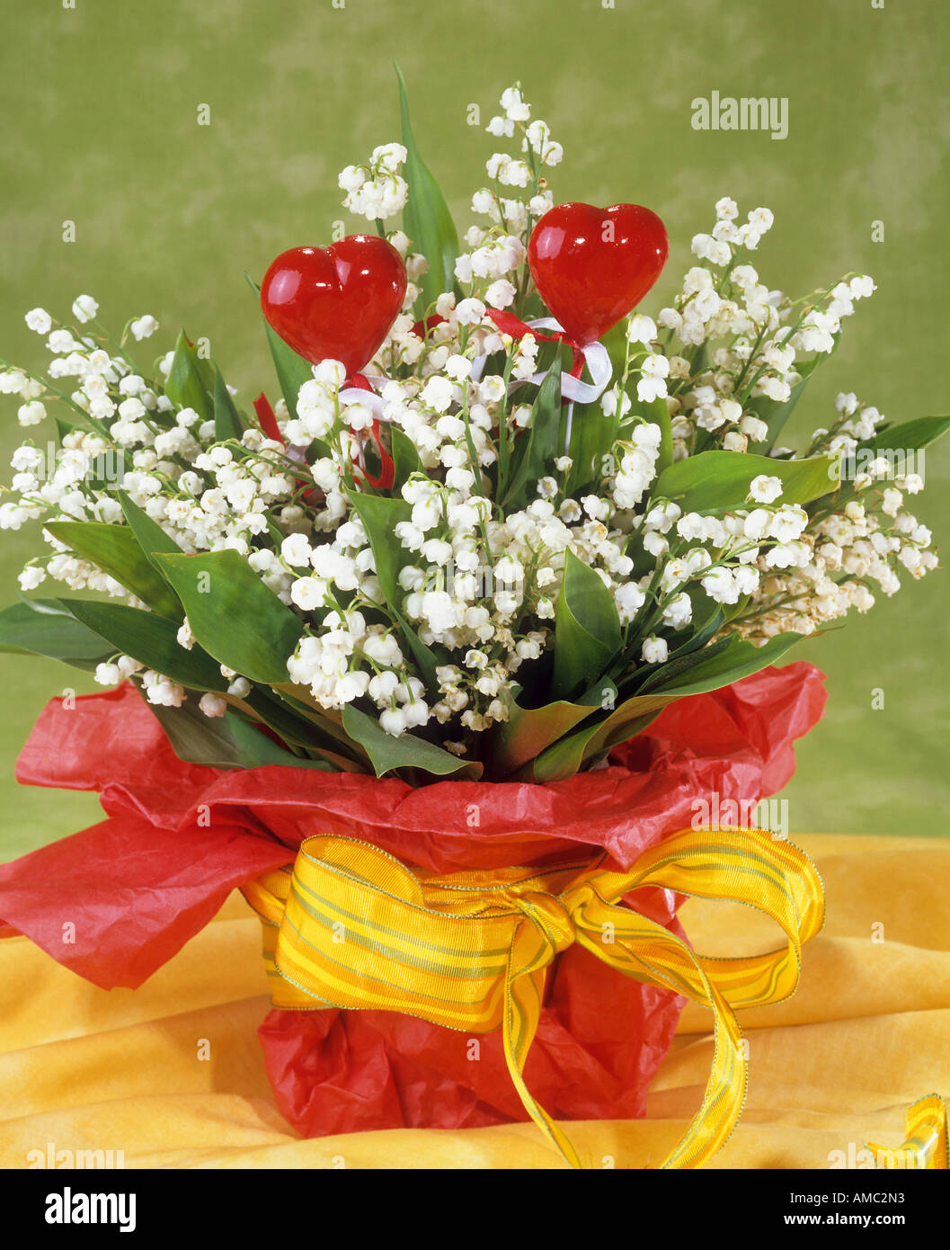 bouquet : Lily of the Valley with decoration / Convallaria majalis Stock Photo