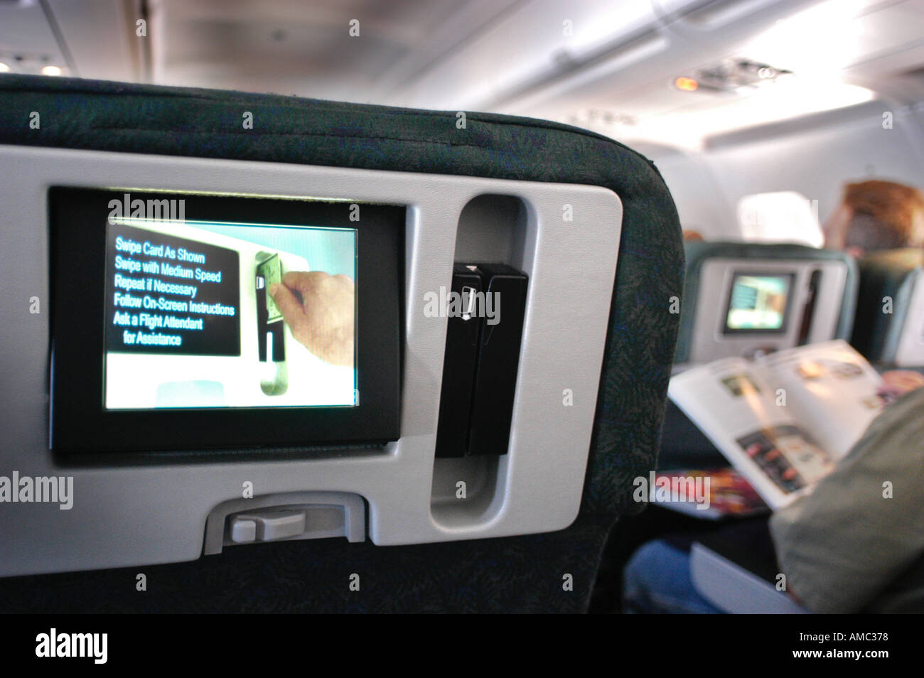 In flight TV screen sets in seats of Boeing 767 Frontier Airlines Stock
