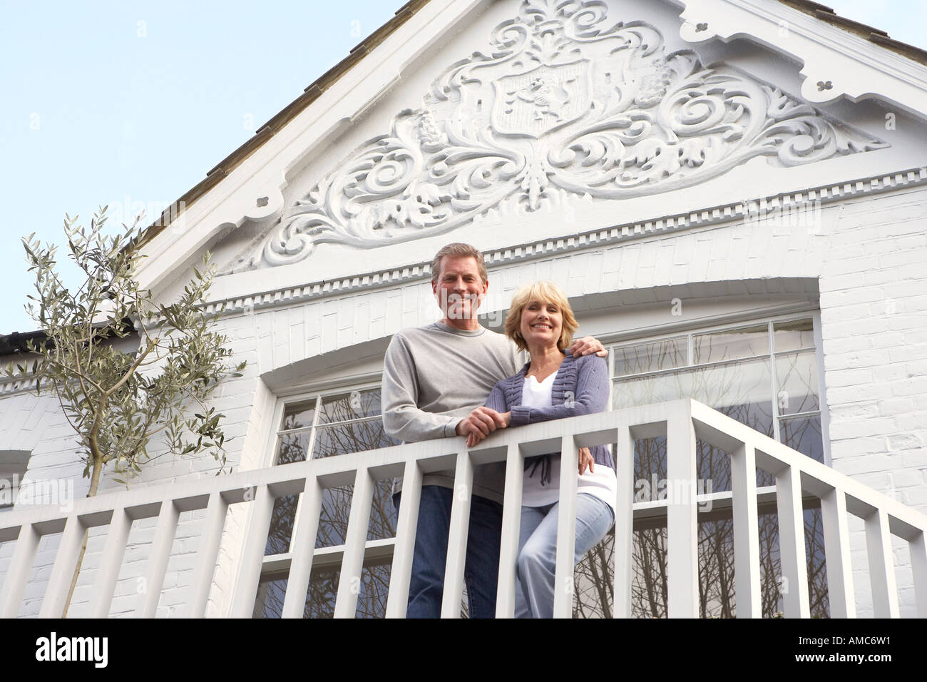 Couple Standing on Balcony Stock Photo