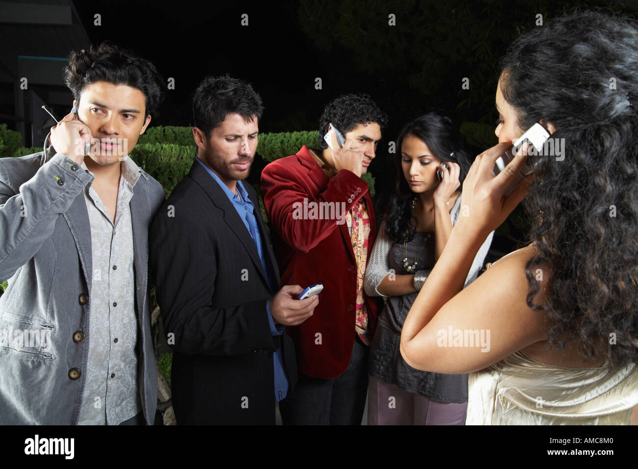 Group Using Cellular Phones Stock Photo