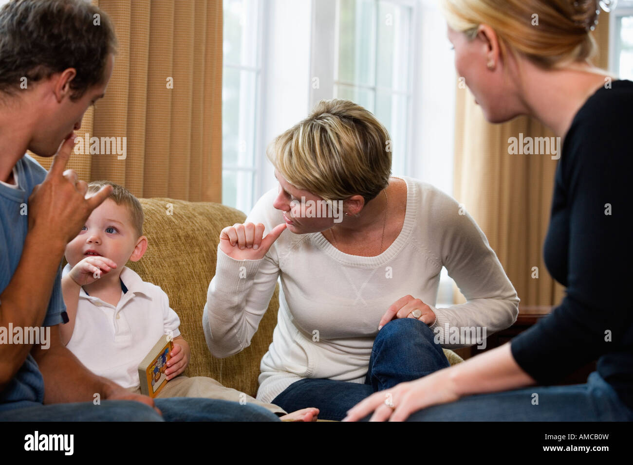 Family conversing in sign language. Stock Photo