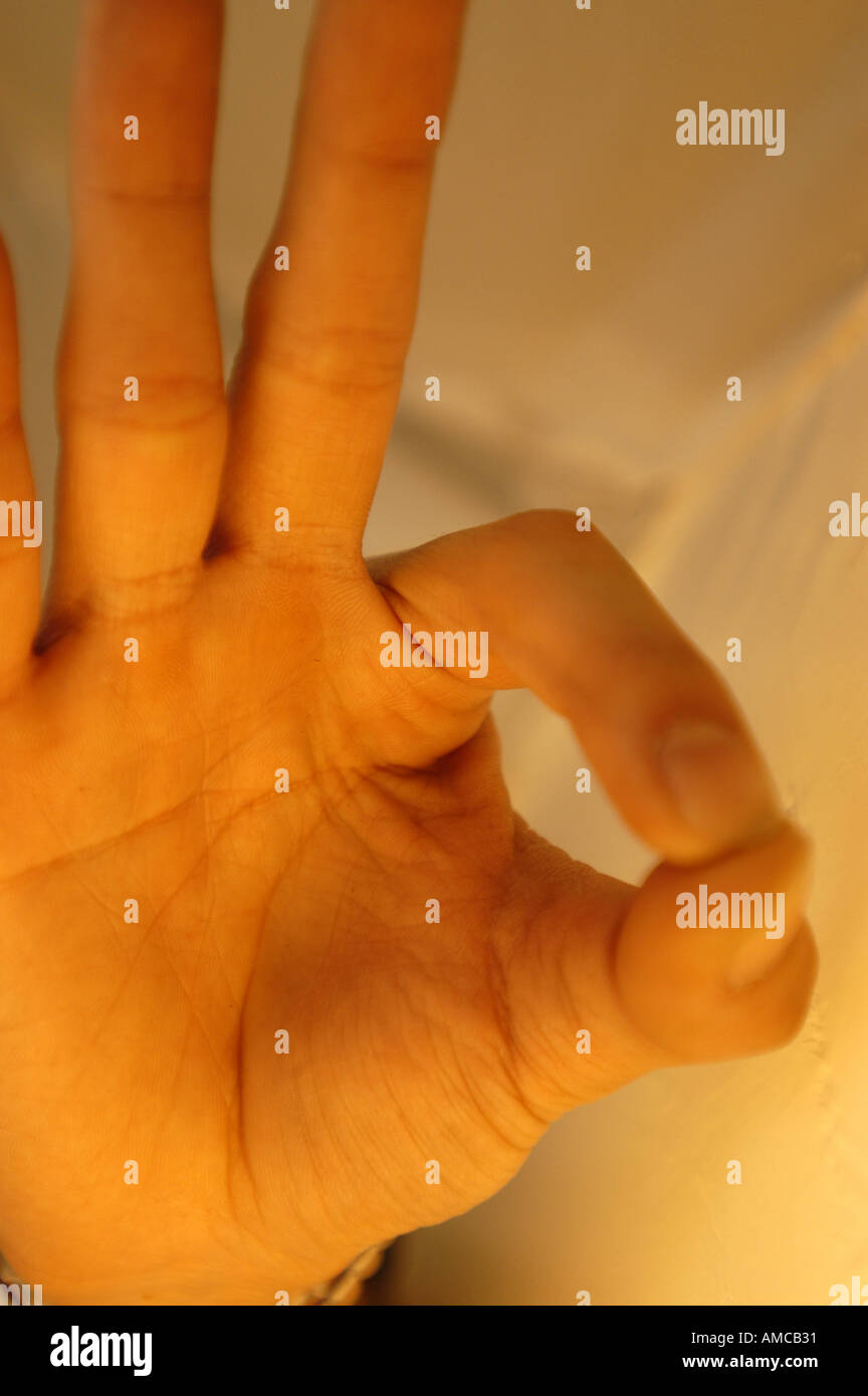 Hand making good okay sign Stock Photo - Alamy