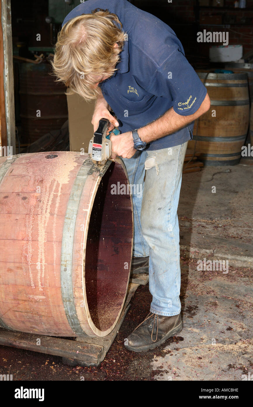 Cooper in action, remodelling wine barrel into garden fountain, Rutherglen, Victoria, Australia