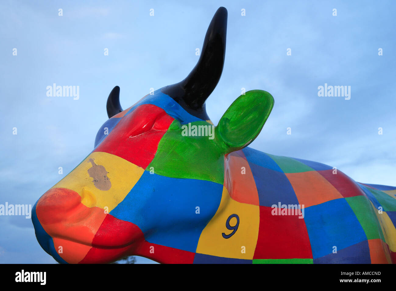 Interactive public art exhibition of painted fibreglass cows in park head detail Shepparton Victoria Australia Stock Photo