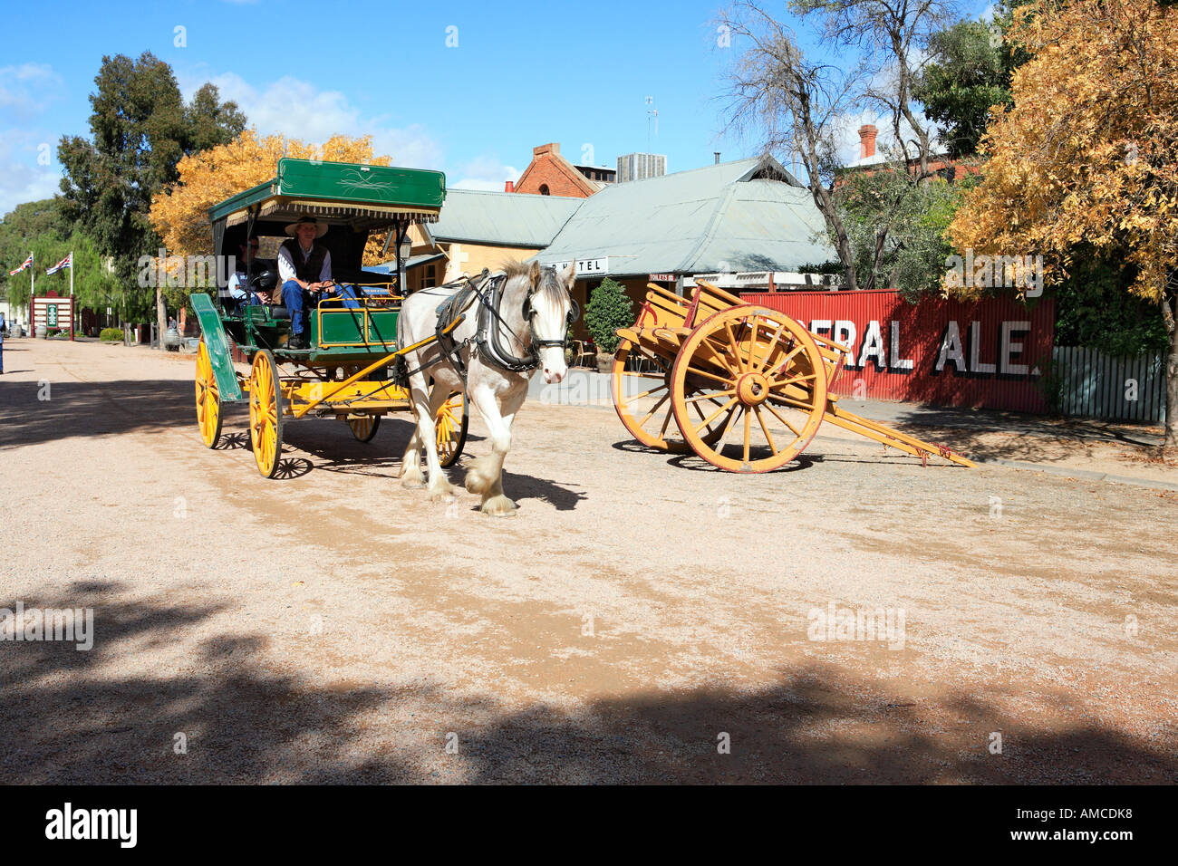 Green and yellow carriage and draught horse on Murray Esplanade, Echuca, Victoria, Australia Stock Photo