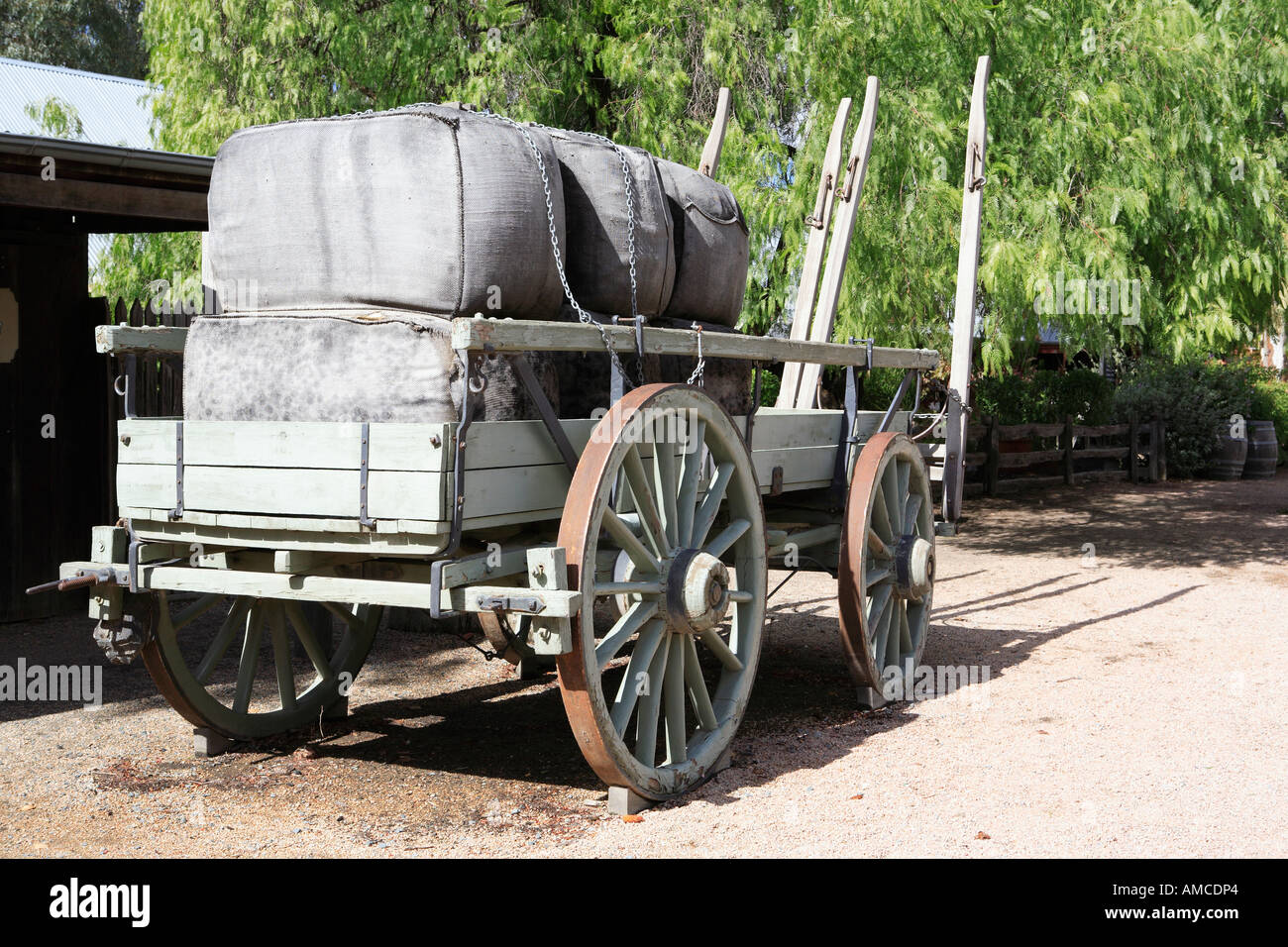 Large grey wool bales loaded onto a two horse farm wagon, Murray Esplanade, Echuca, Victoria, Australia Stock Photo