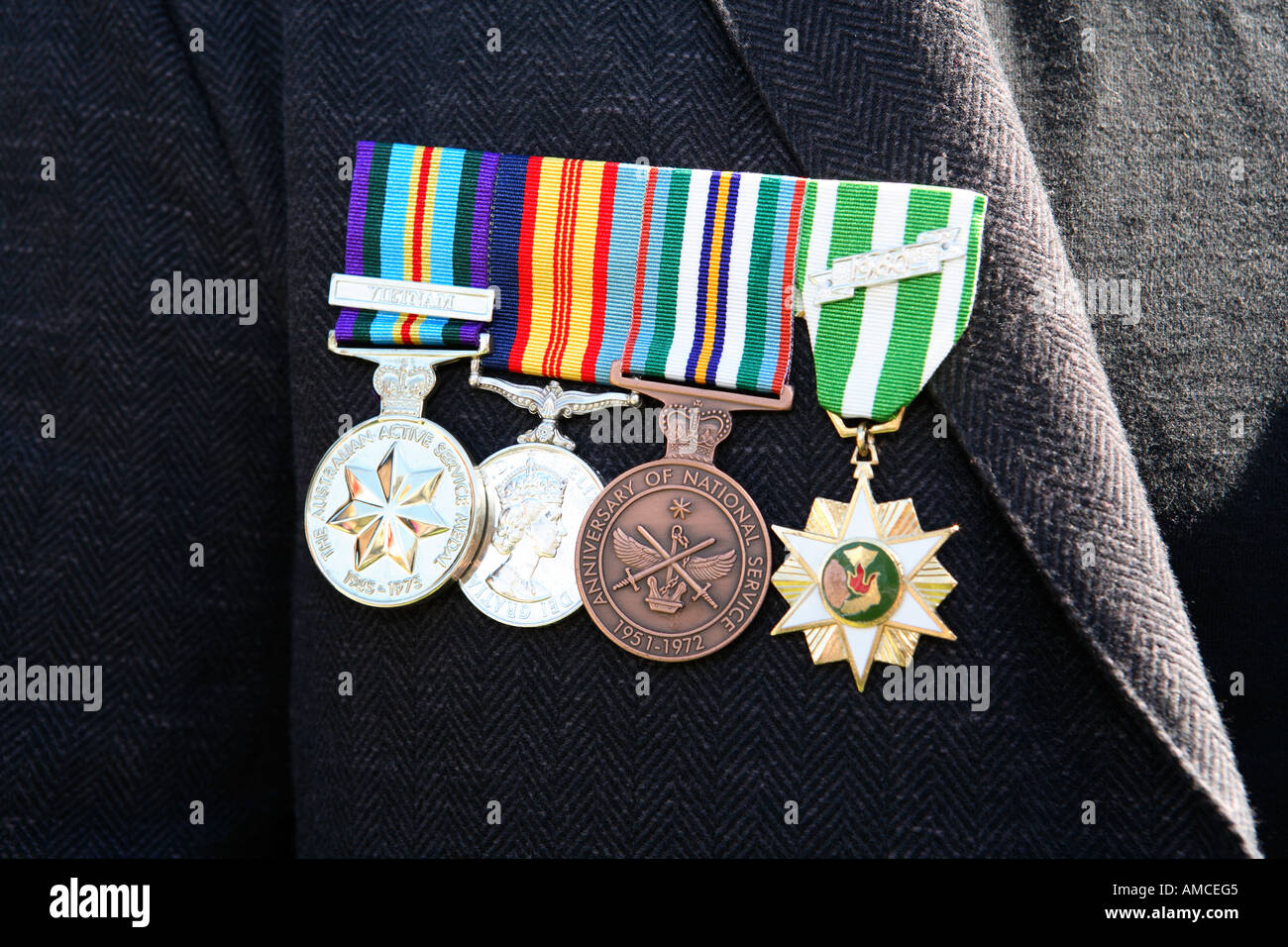 Four medals of bravery worn by war veteran on Anzac day, Australia Stock Photo