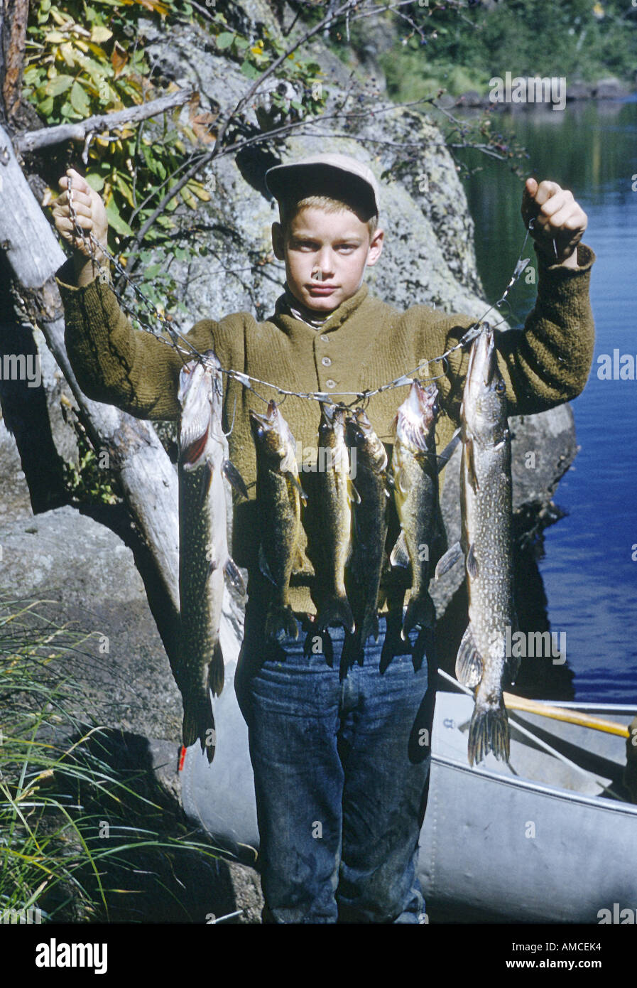 boy with fishing catch Stock Photo