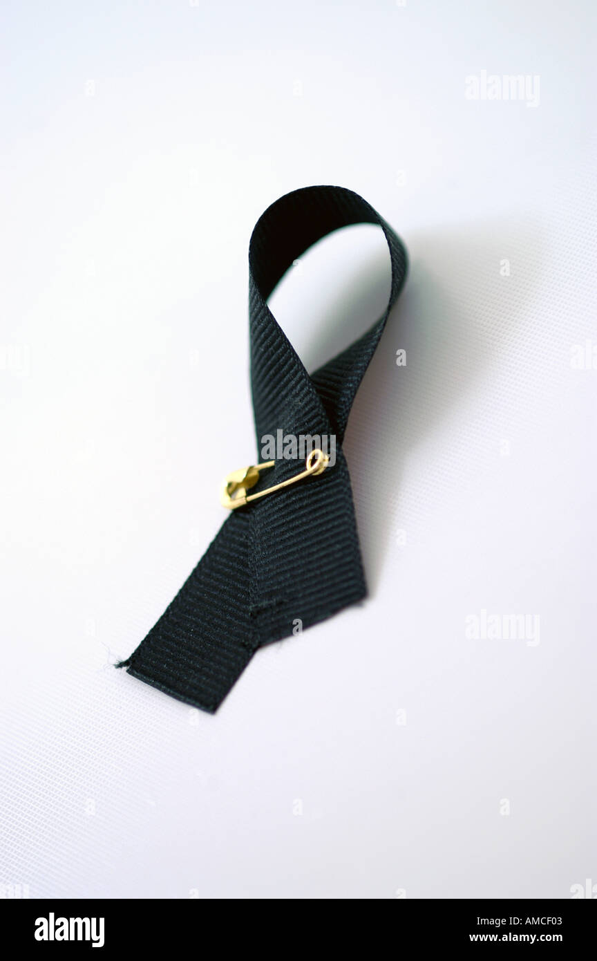 Black ribbon symbol safety pin vertical Stock Photo - Alamy
