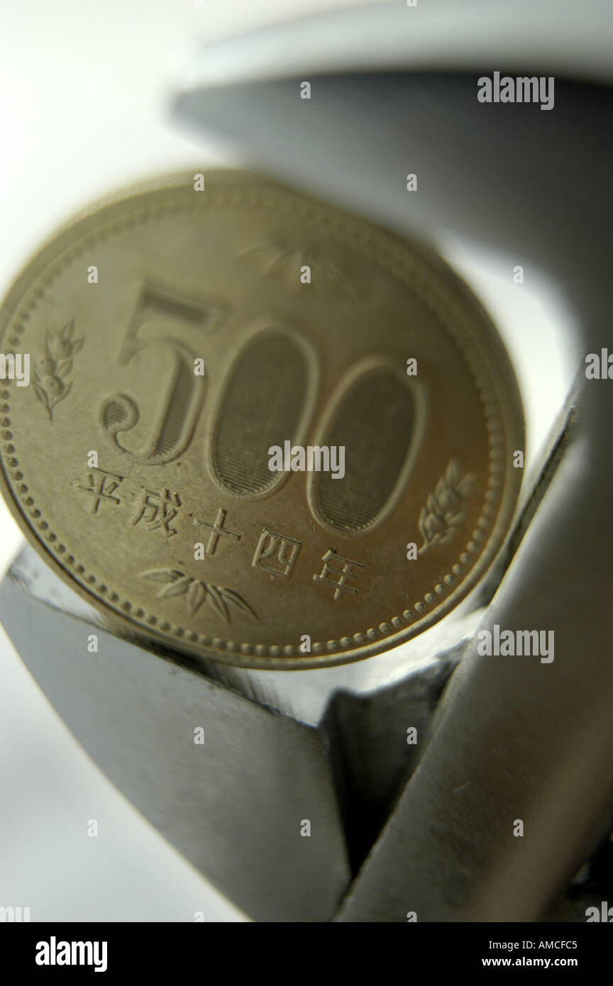 500 five hundred yen coin in measuring tool vertical Stock Photo