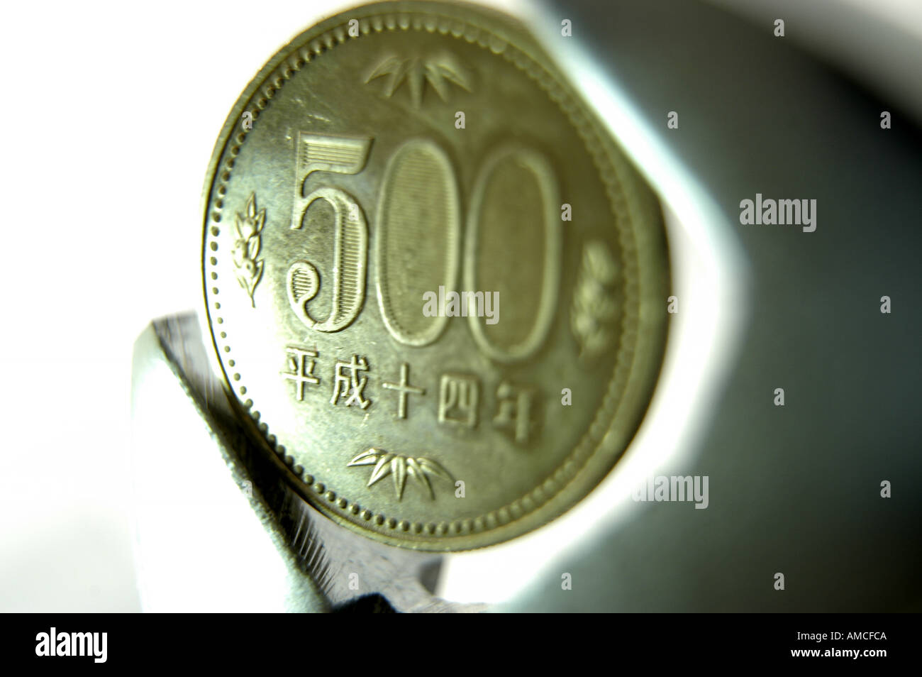 500 five hundred yen coin in measuring tool horizontal Stock Photo