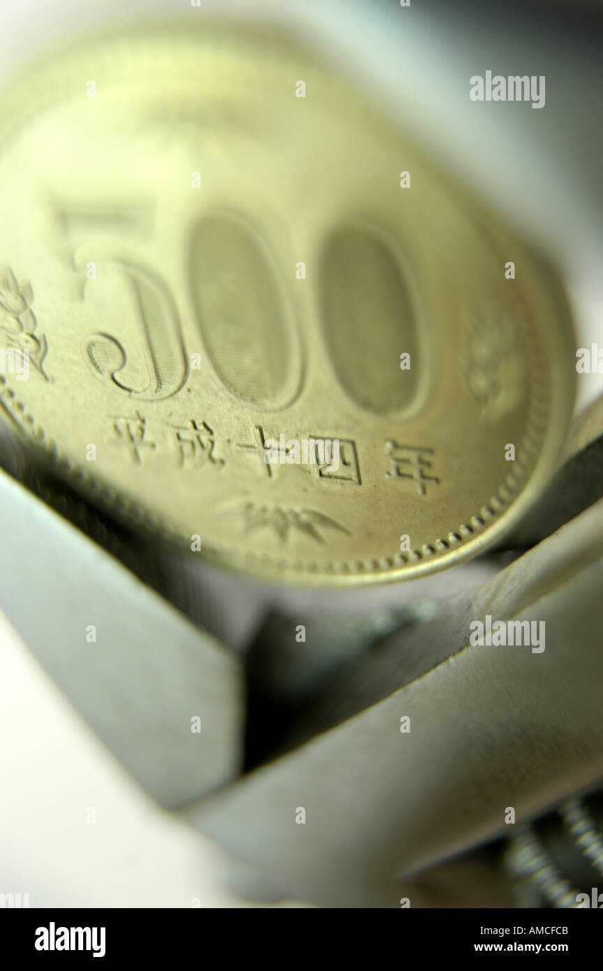 500 five hundred yen coin in measuring tool vertical Stock Photo