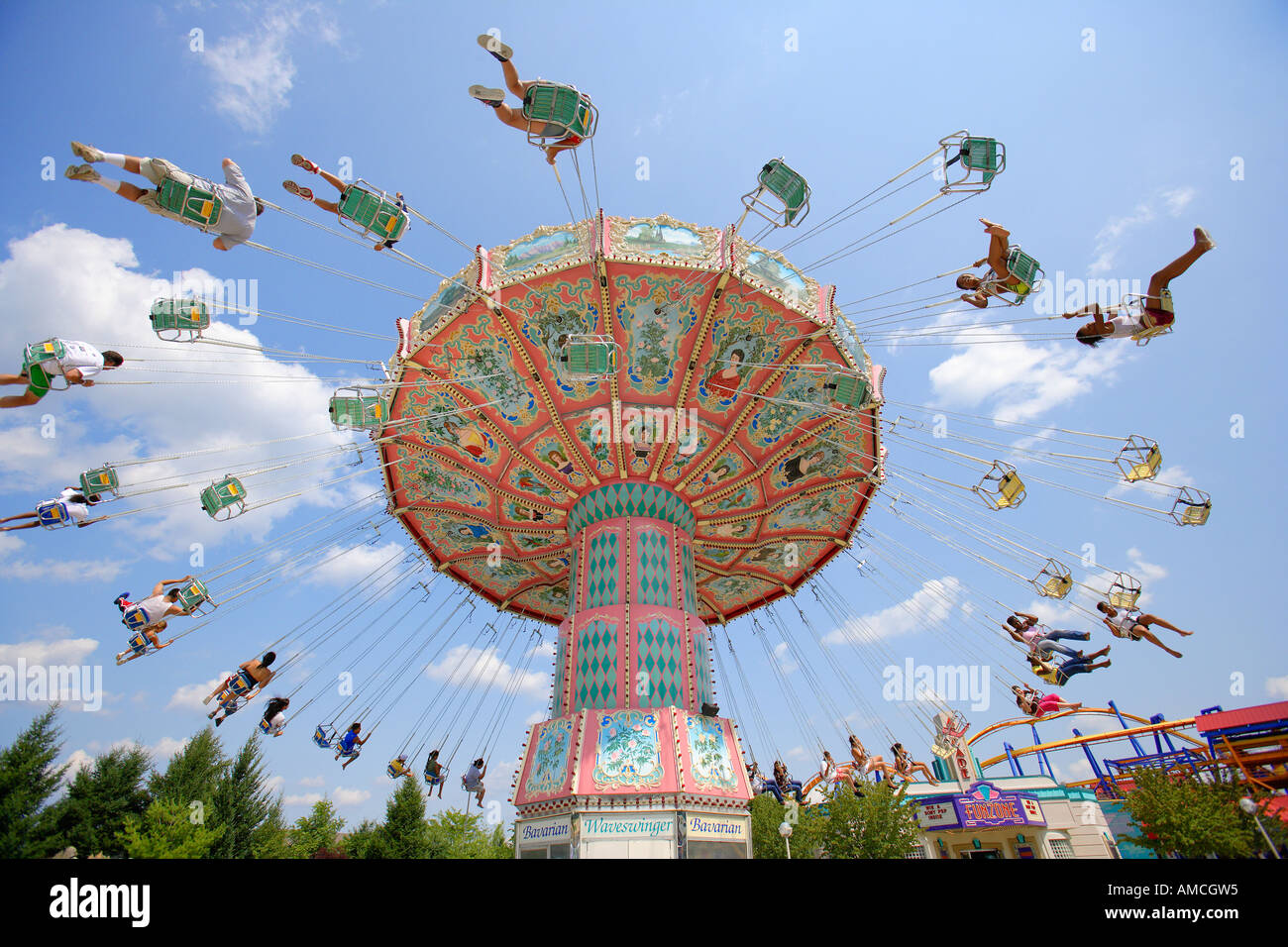 Spinning Swings at Amusement Park Stock Photo