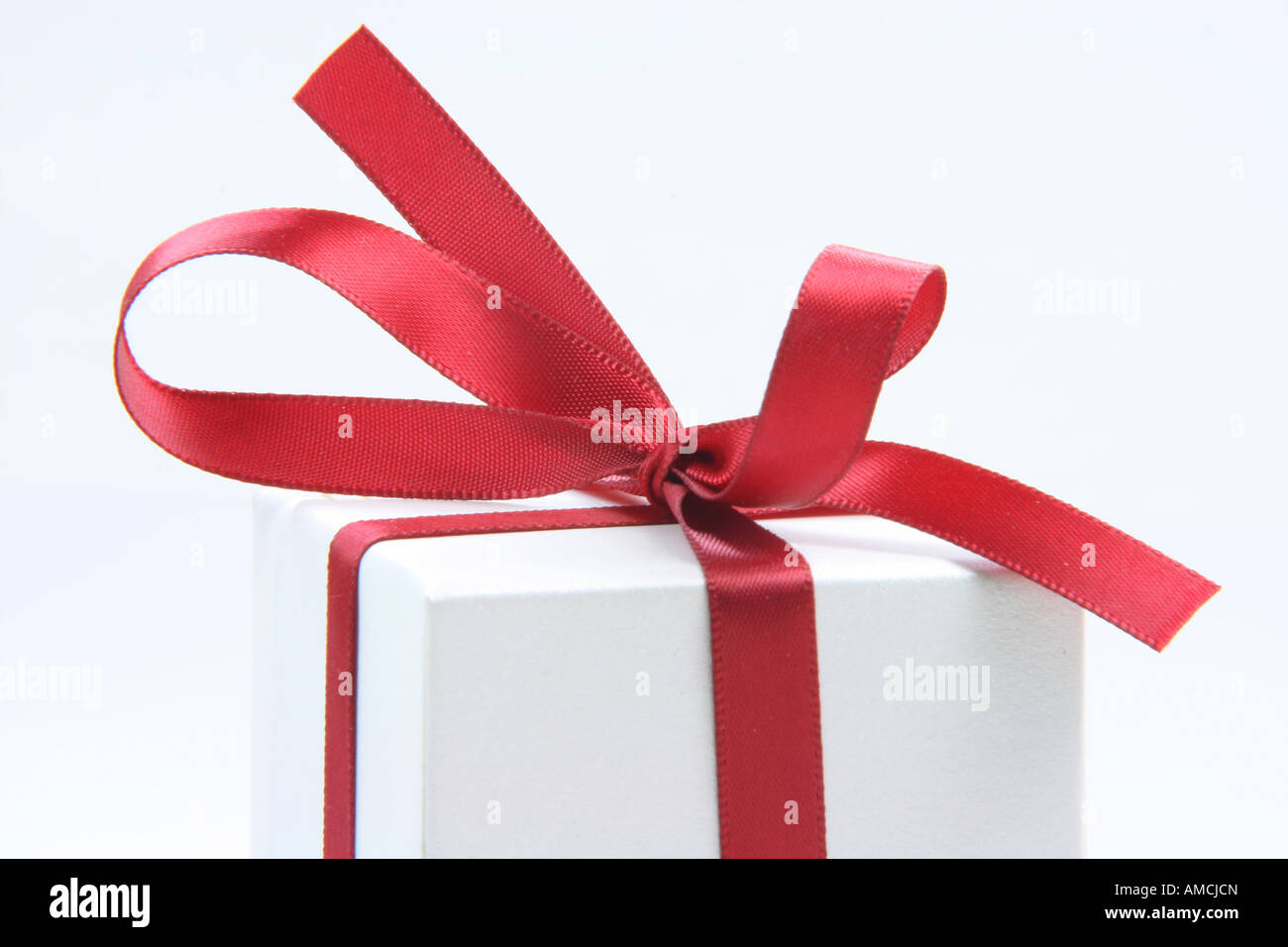 closeup gift box with red ribbon isolated on white background Stock ...