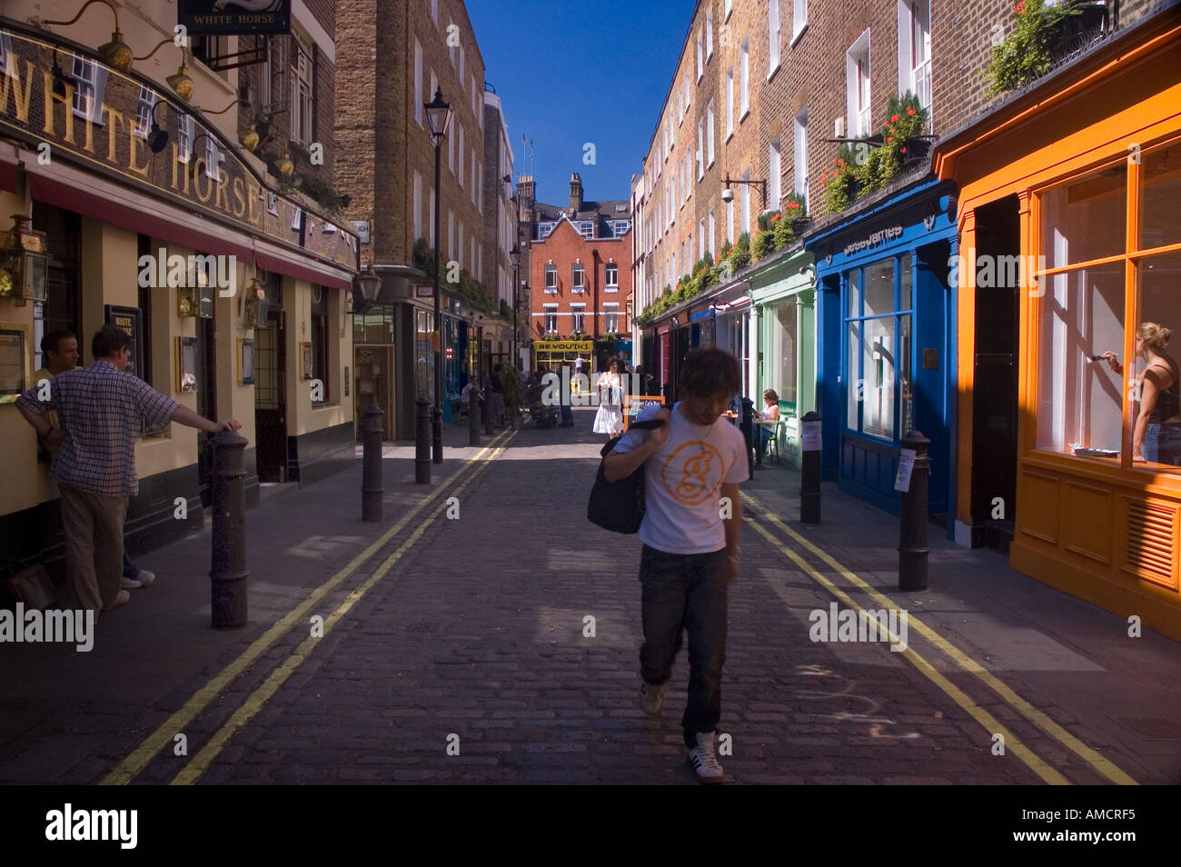 Stores along a road, Newburgh Street, Soho, London, England Stock Photo