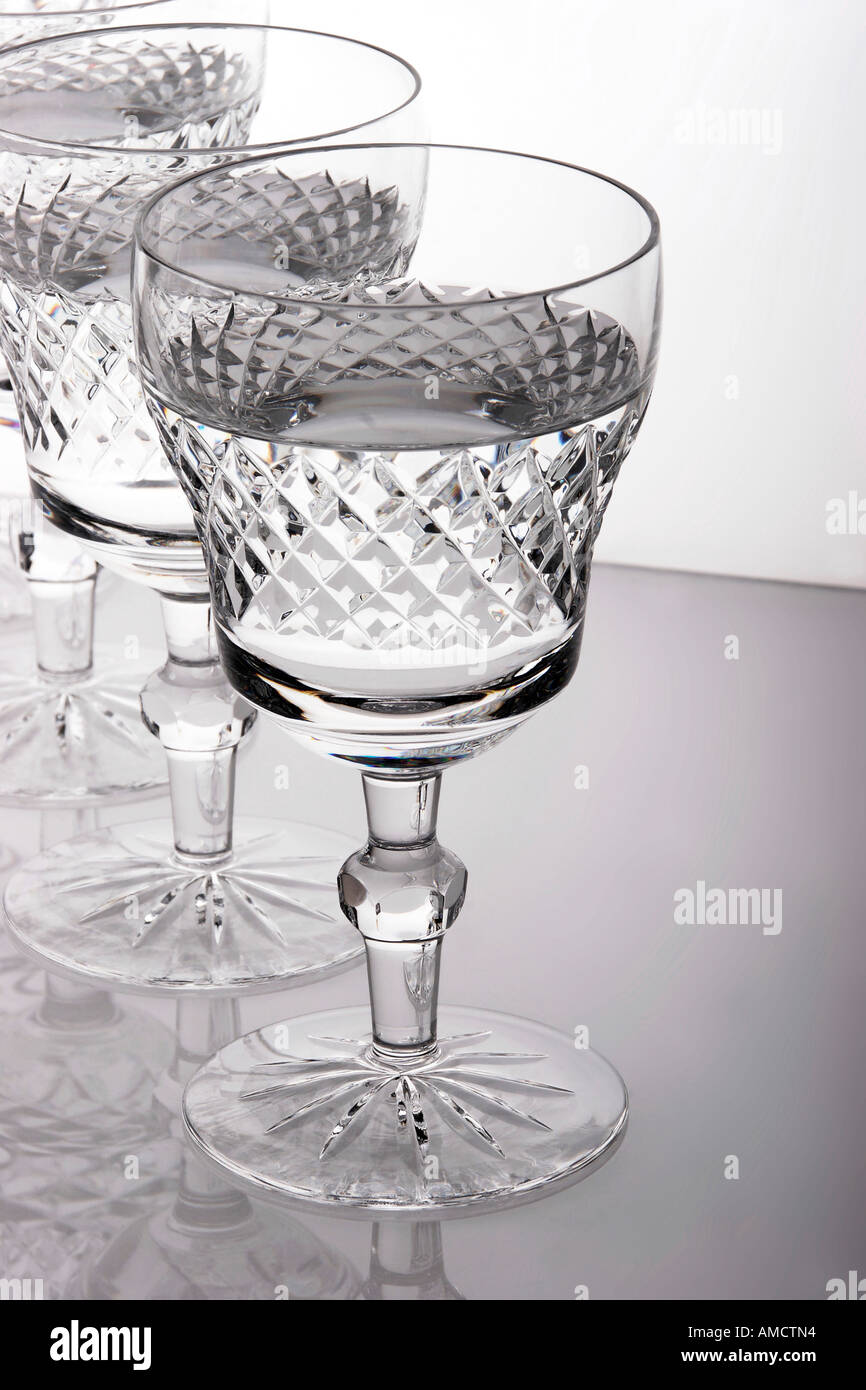 Three glasses in row with water elevated view Stock Photo