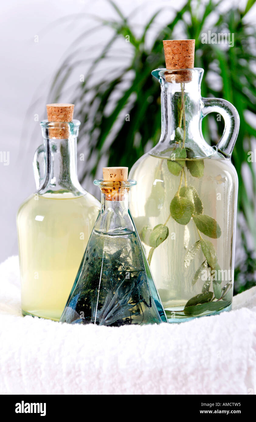 Massage oil in jugs and beaker close up Stock Photo