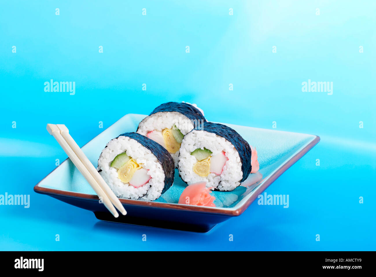 Plate of sushi with ginger and chopsticks Stock Photo