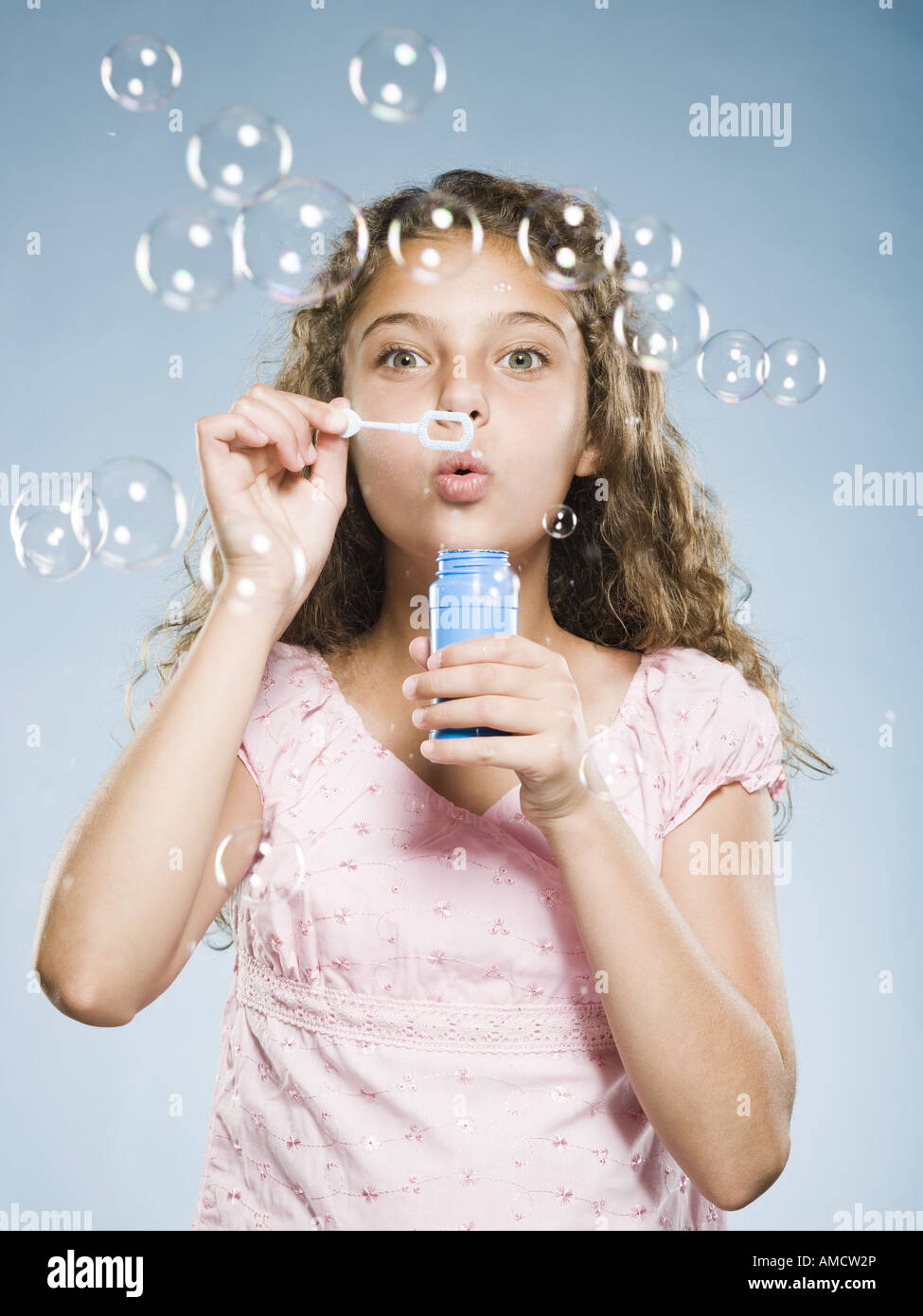 Girl blowing bubbles Stock Photo Alamy