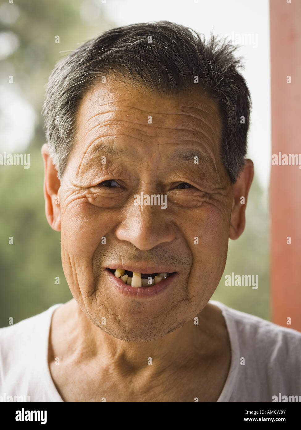 Portrait of a toothless man outdoors smiling Stock Photo