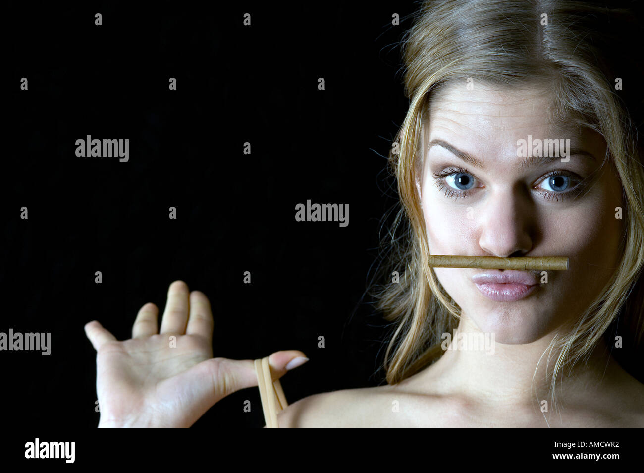 Young Woman with cigar Stock Photo