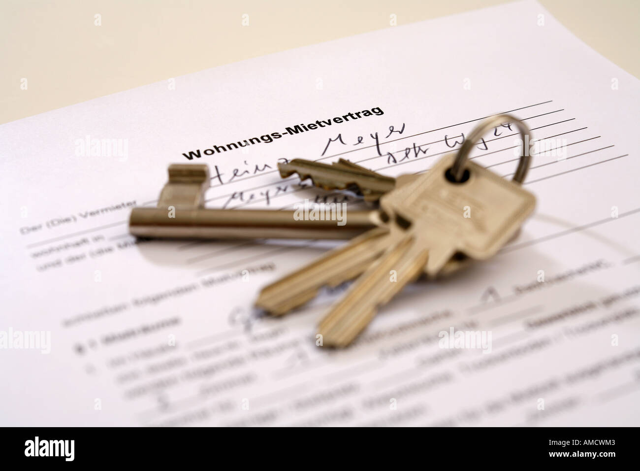 A bunch of keys lying on the document Stock Photo